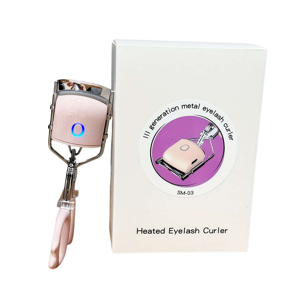 Heated eyelash curler with packaging on a white background