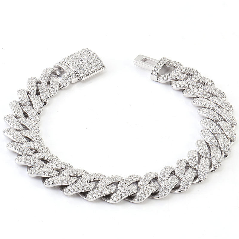 Silver chain bracelet with clear gemstones on a white background