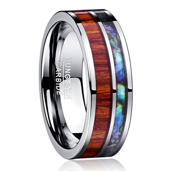 Tungsten carbide ring with wooden and abalone shell inlay on a white background