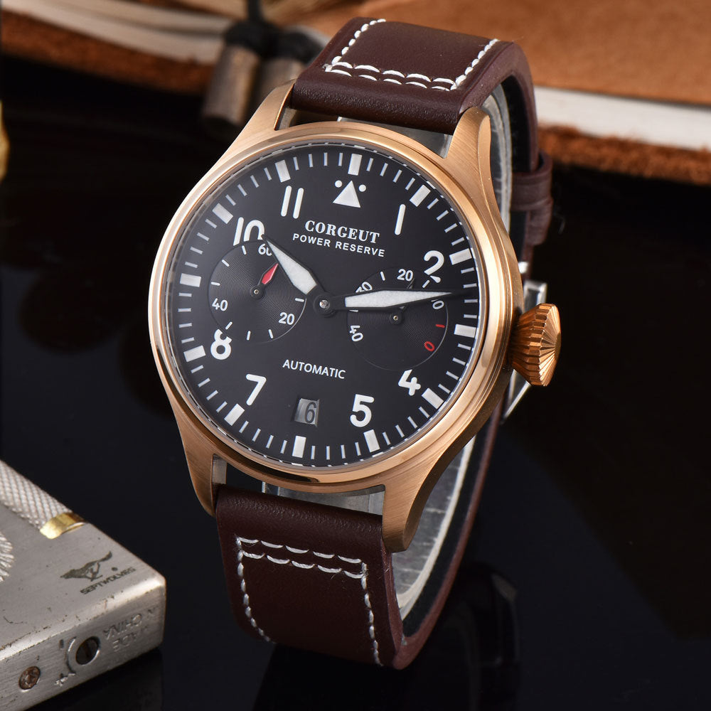 Watch with brown leather strap and black dial on a dark background