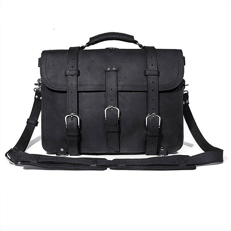 Black leather briefcase with multiple straps on a white background