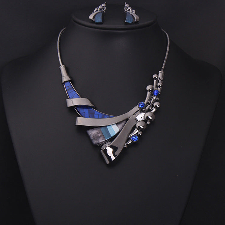 Jewelry set with necklace and earrings on a black background