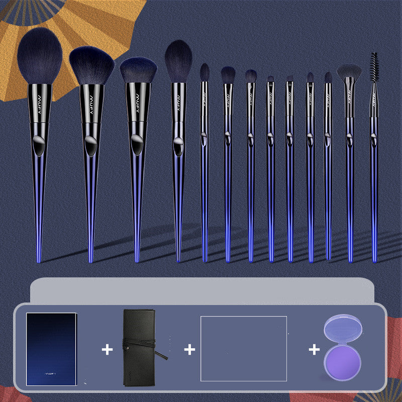 Set of makeup brushes with a carrying case on a blue background