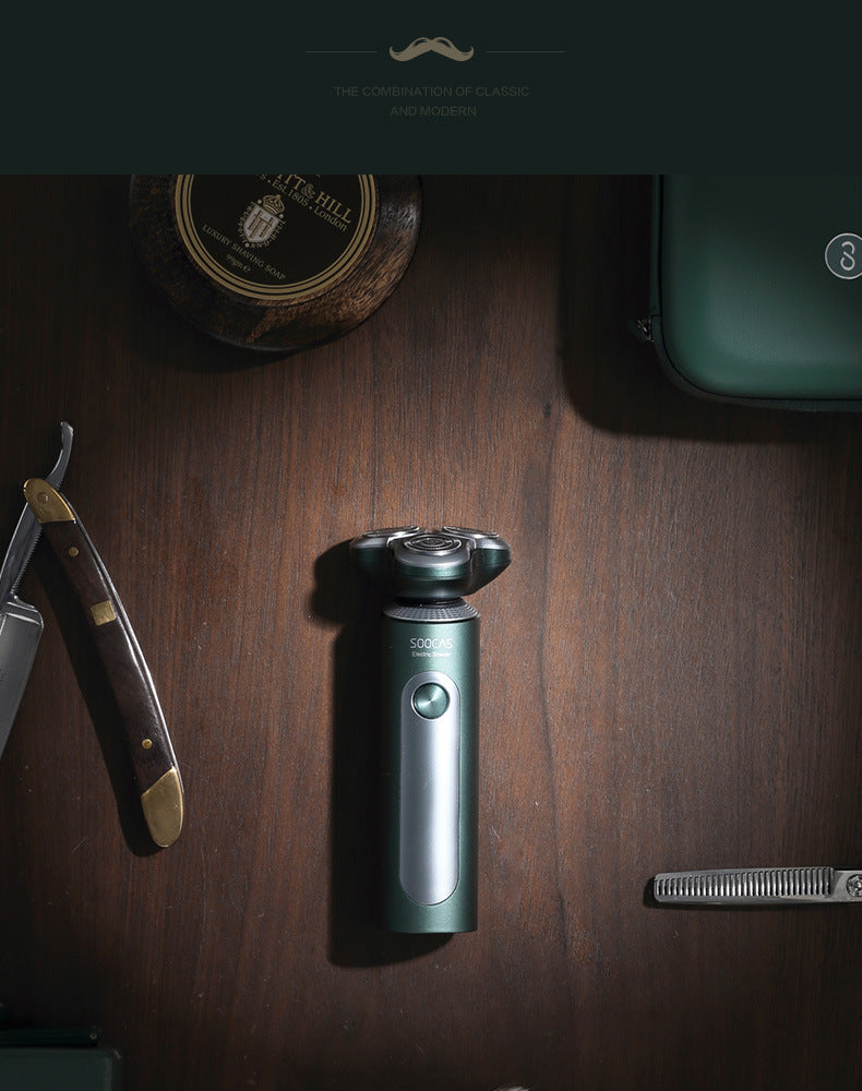 Shaving tools including a shaver, razor, and brush on a wooden surface with a brand logo.