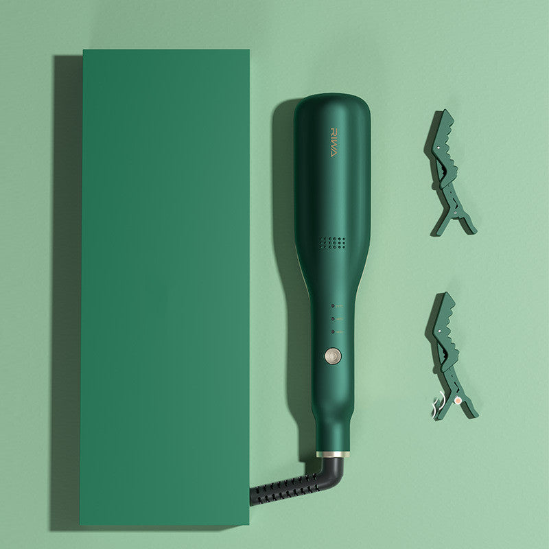 Green hair straightener with attachments on a green background