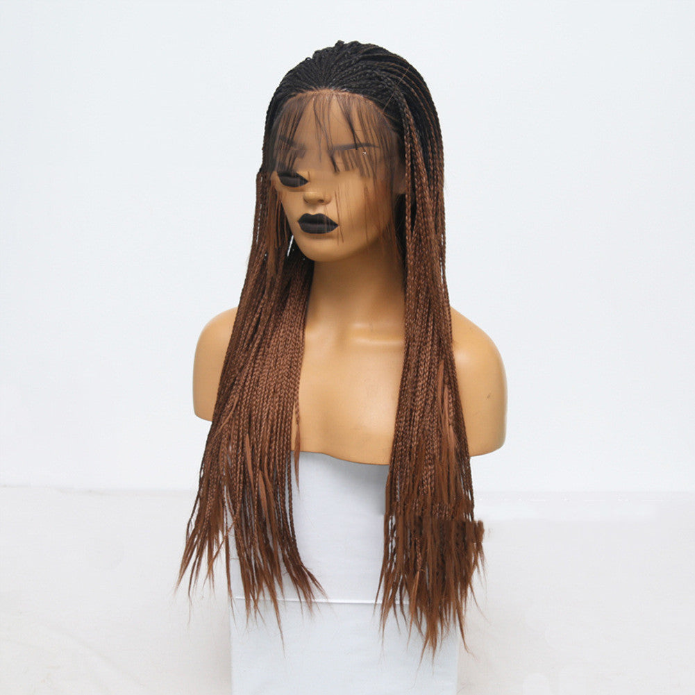 Mannequin head with a brown braided wig on a white background