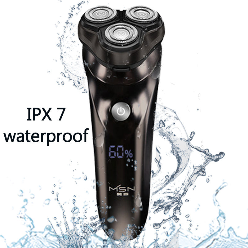 Black electric shaver with water splashes and 'IPX 7 waterproof' text on a white background