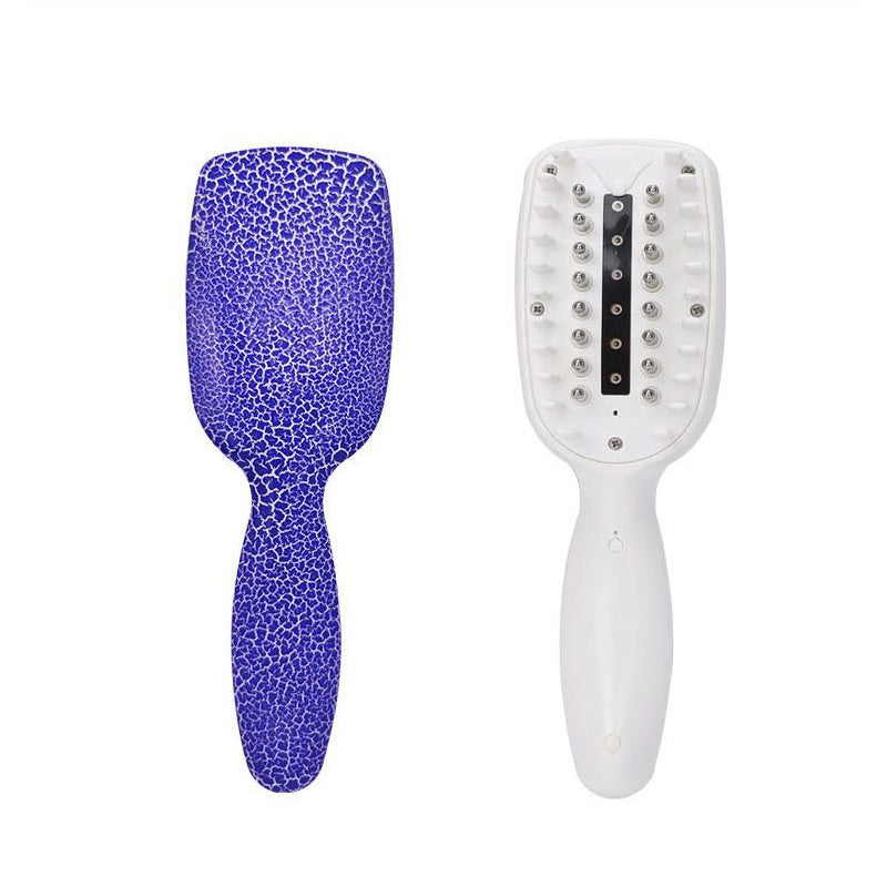 Purple textured paddle brush and white brush with black bristles on a white background