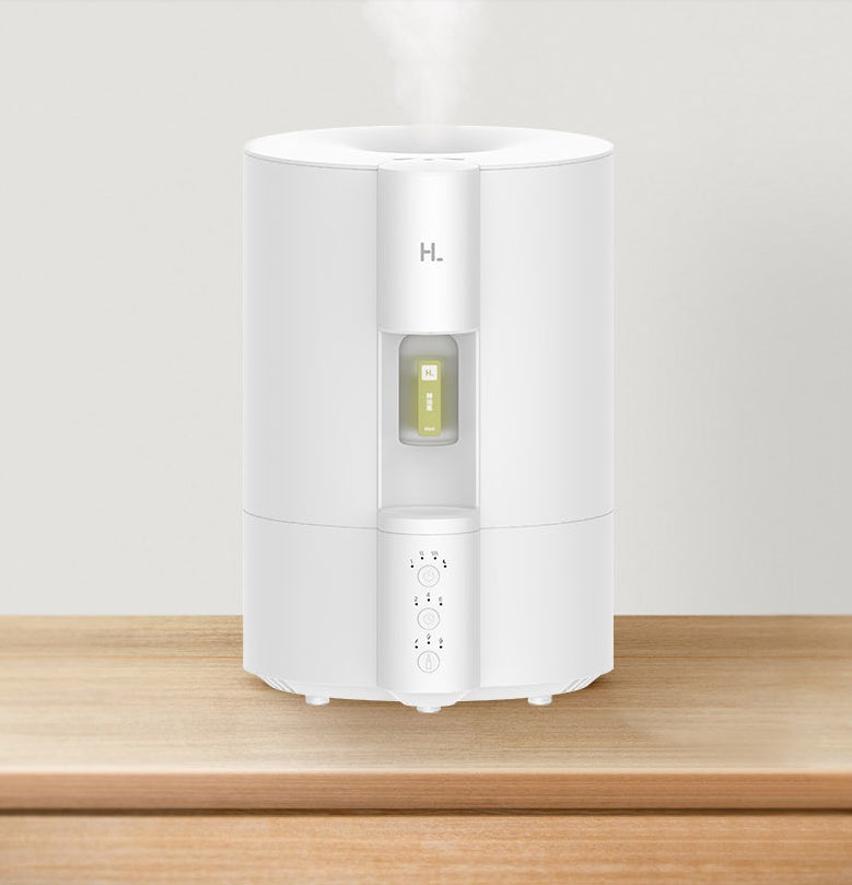 White humidifier on a wooden surface with a light gray background