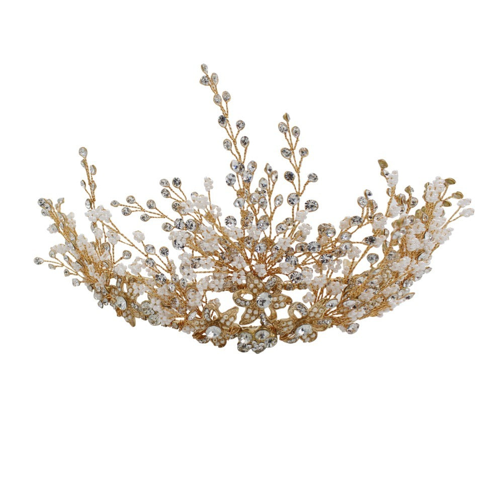 Gold and pearl tiara on a white background