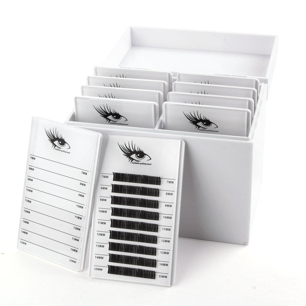 Eyelash extension kit with multiple trays on a white background