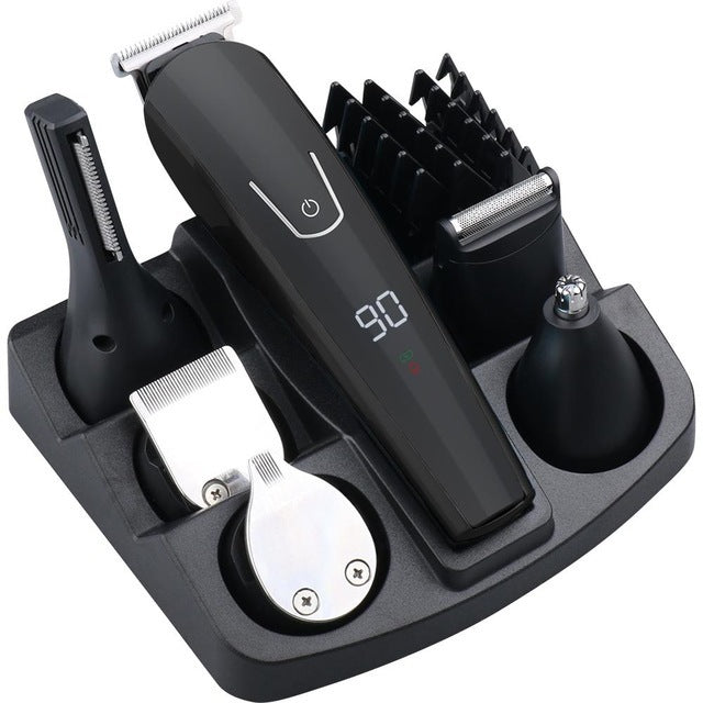 Set of grooming tools including a hair trimmer, comb, and other attachments on a white background