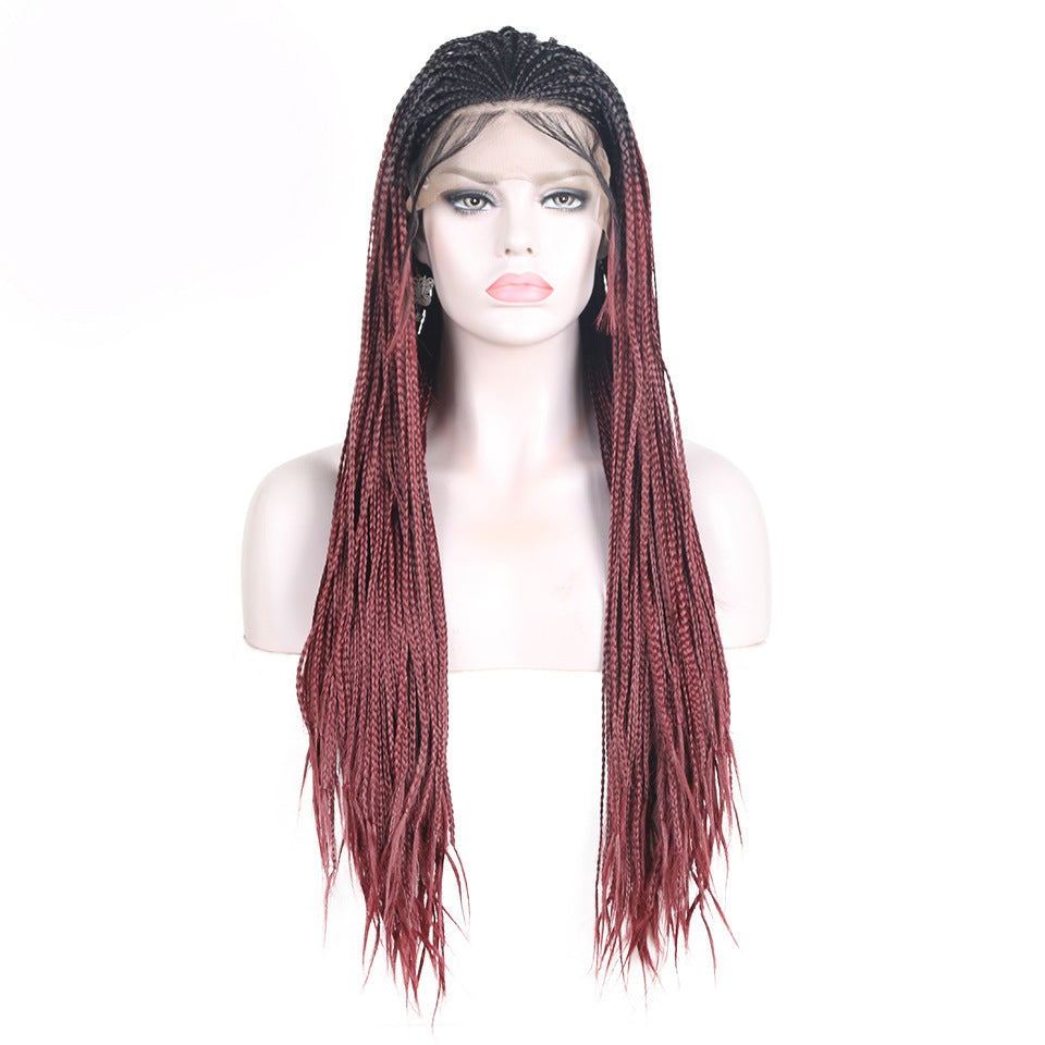 Mannequin head with a red and black braided wig on a white background