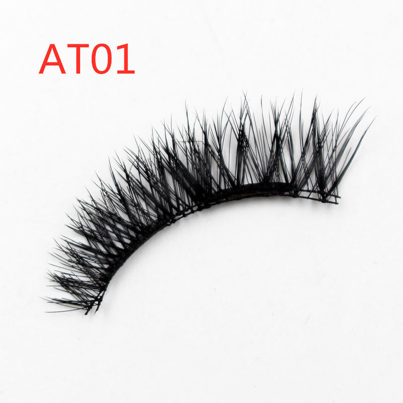 Black false eyelash labeled 'AT01' on a white background