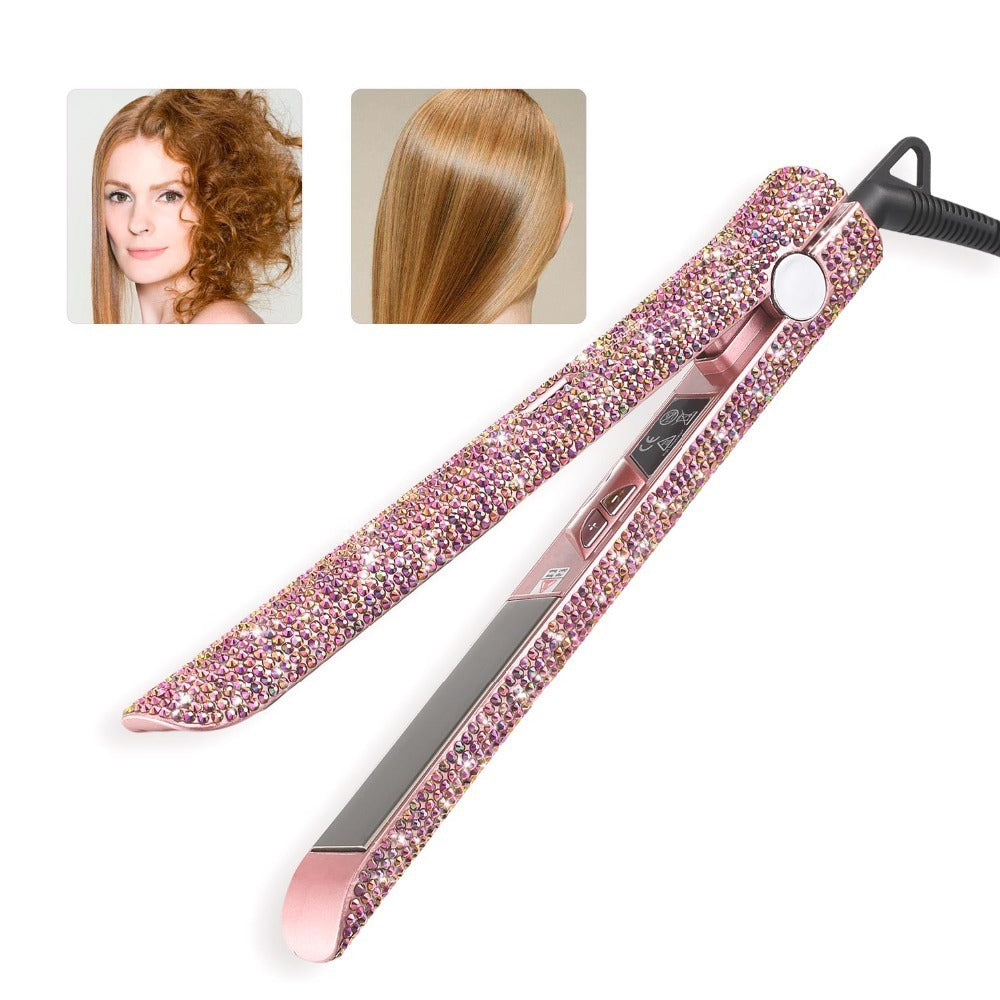 Pink hair straightener with rhinestone embellishments on a white background