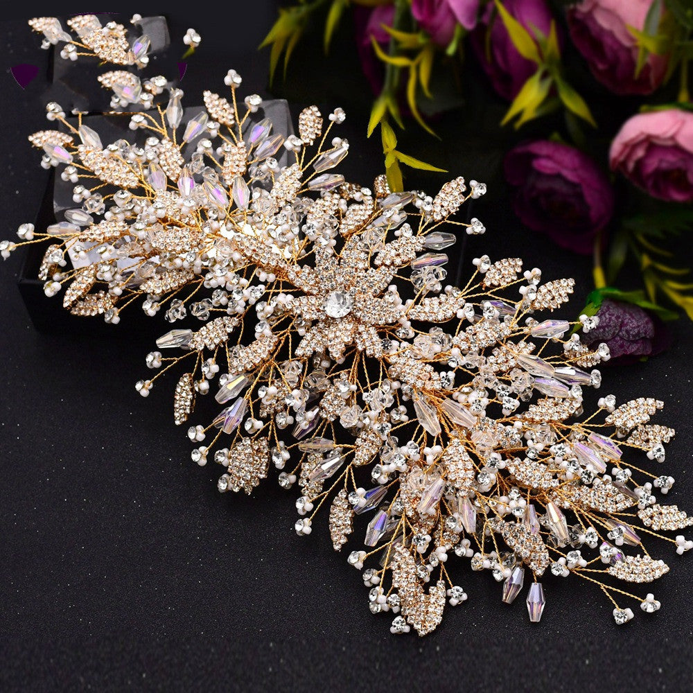 Decorative brooch with crystals and pearls on a black background