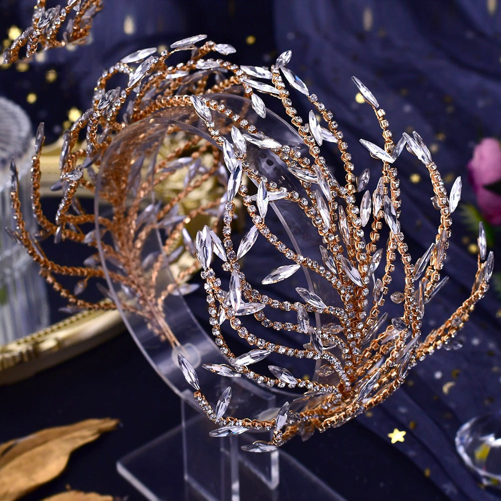 Decorative headband with gold and silver elements on a dark background