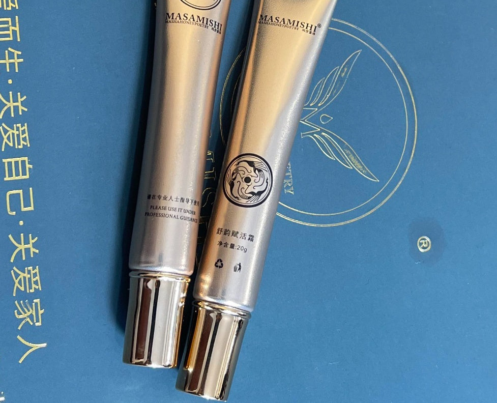 Two silver cosmetic tubes with a brand logo on a blue background