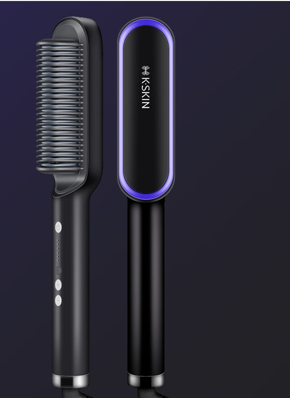 Black hairbrush with bristle head and purple LED light on a dark background