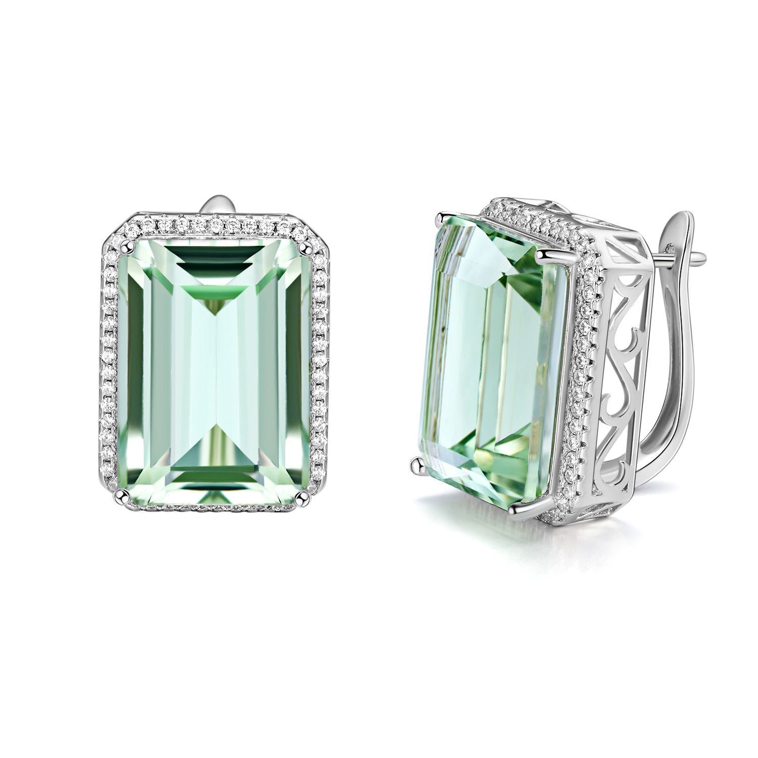 Pair of earrings with green gemstones and silver settings on a white background