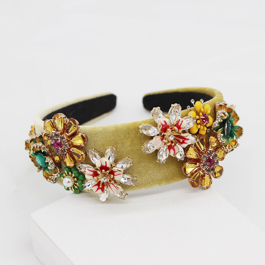 Decorative headband with floral embellishments on a white background