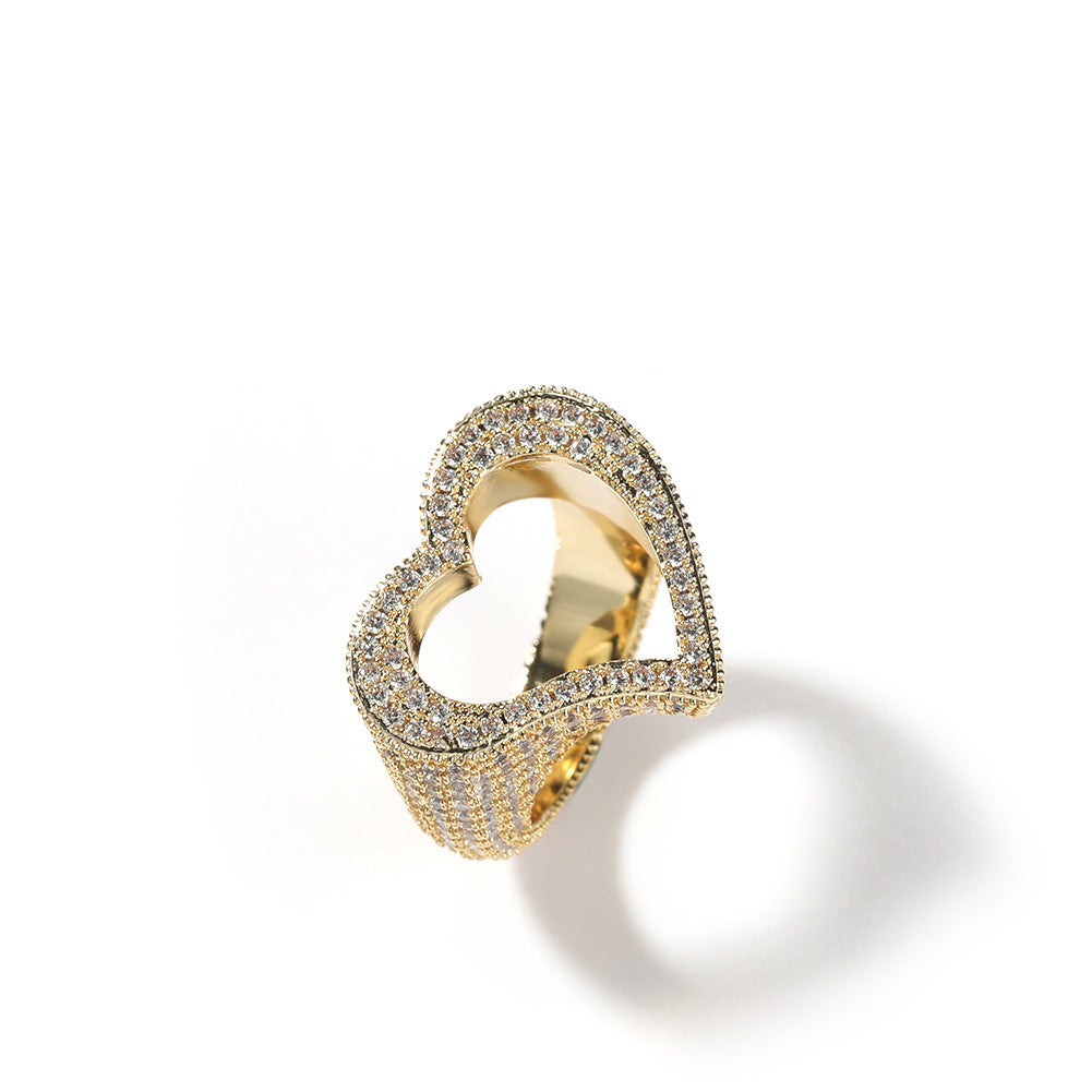 Gold ring with diamond accents on a white background