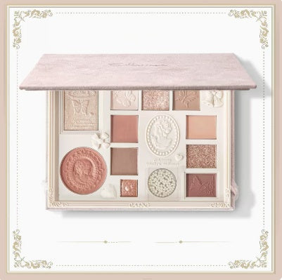 Makeup palette with various shades on a white background