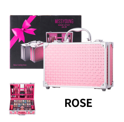 Pink makeup case with accessories and packaging on a white background