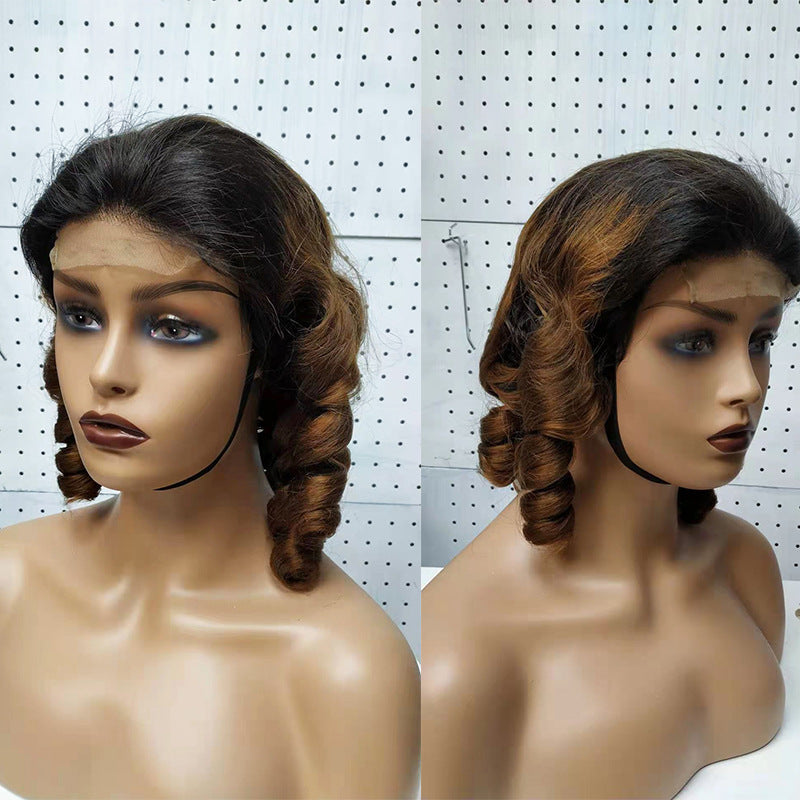 Two views of a womannequin with styled hair against a white pegboard background