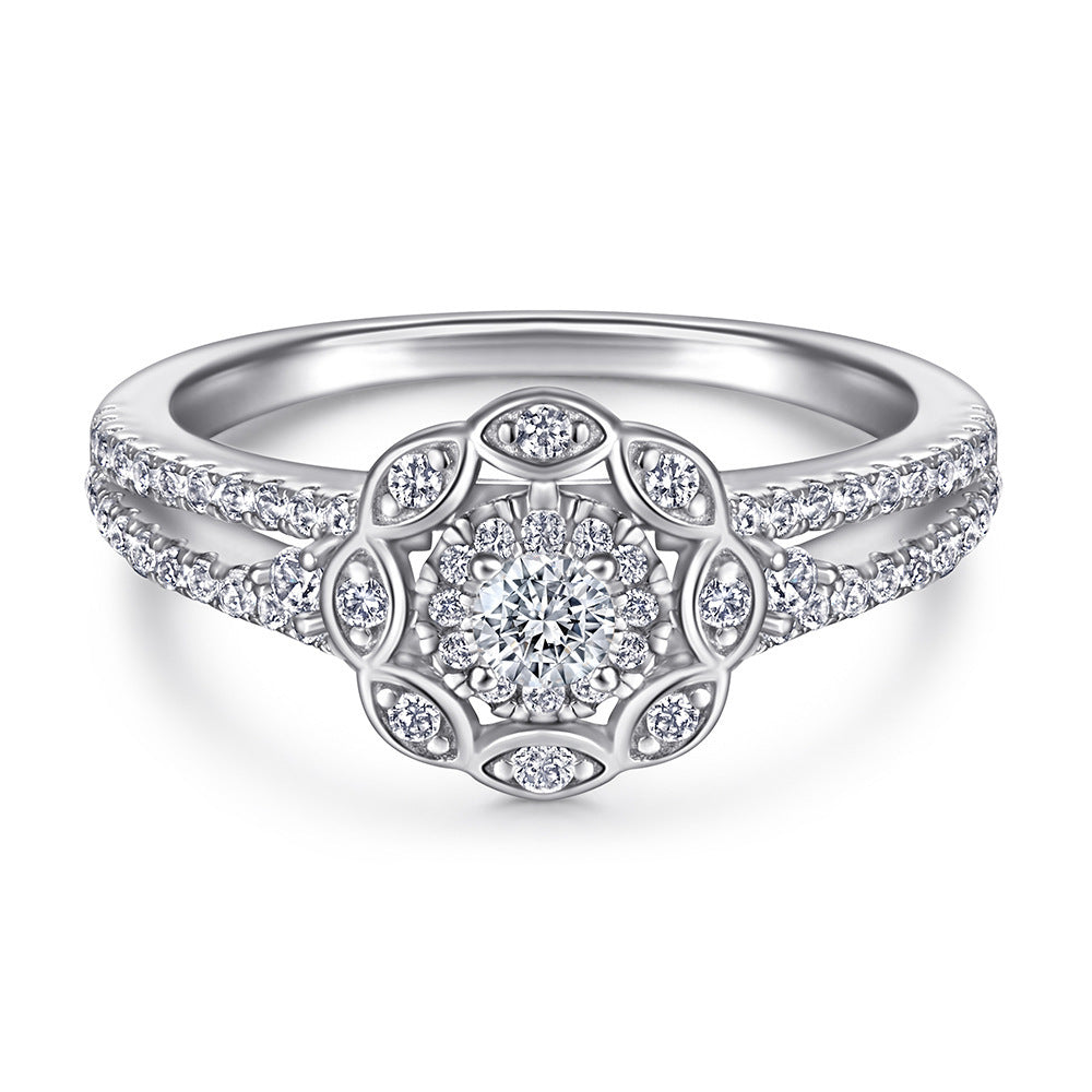 Silver ring with diamond accents on a white background