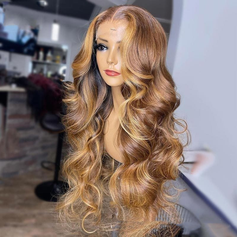 Mannequin head with long, wavy, blonde wig in a blurred indoor setting