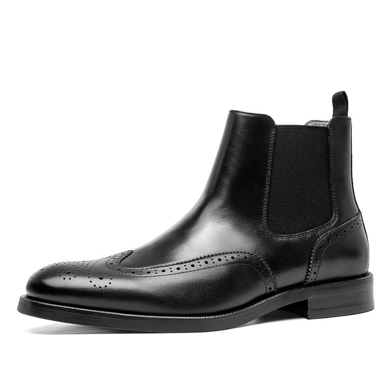 Black leather Chelsea boot on a white background