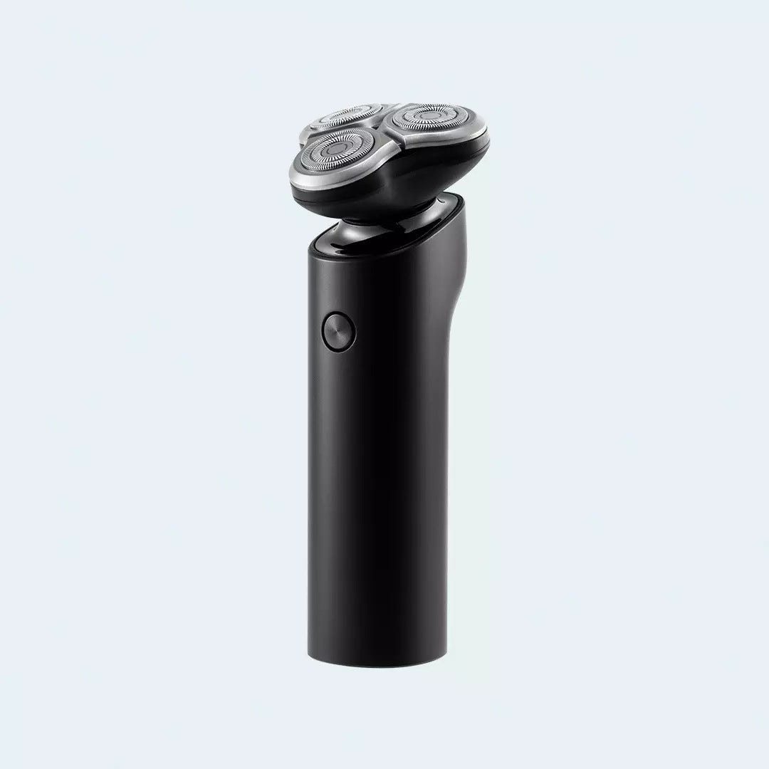 Black electric shaver on a light gray background