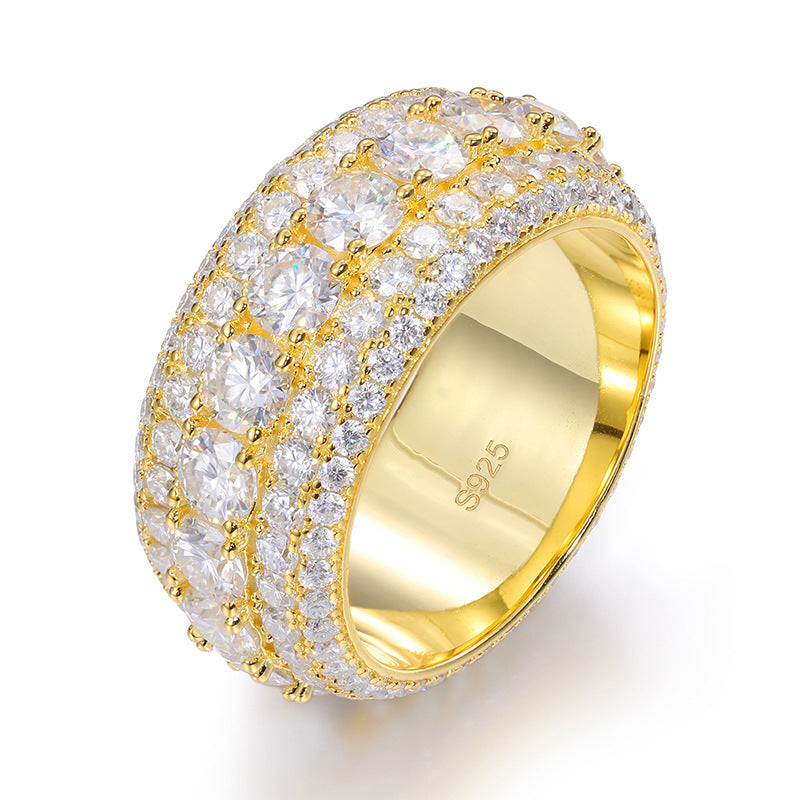 Gold ring with diamond accents on a white background