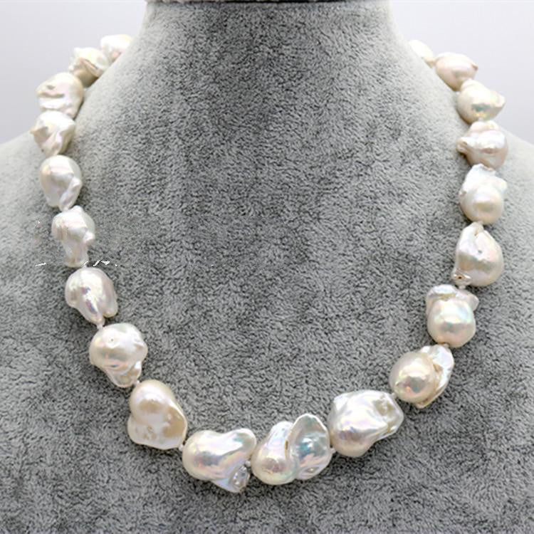 Pearl necklace on a gray stand