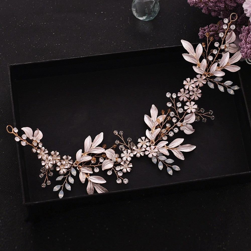 Decorative floral headband with pearls on a black background