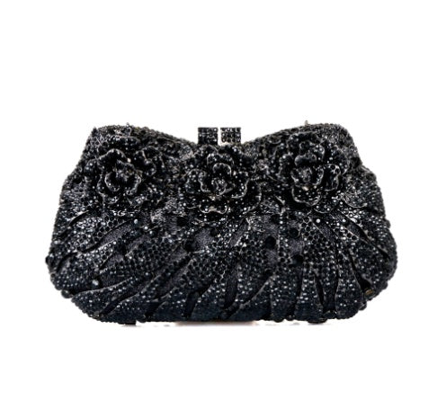 Black beaded clutch bag on a white background