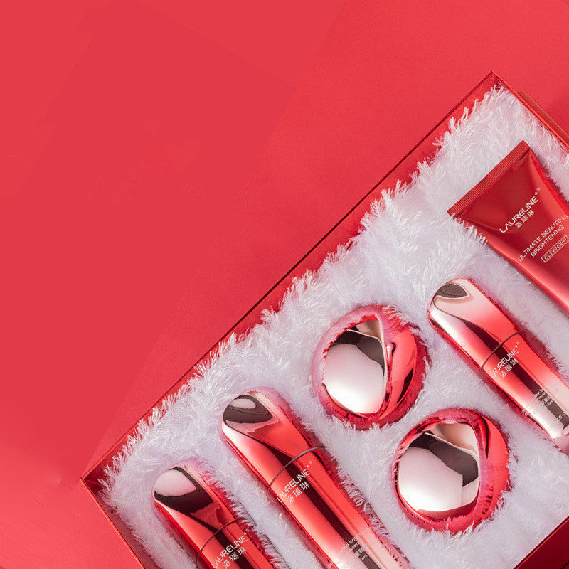 Set of red cosmetic products in a box with a red background