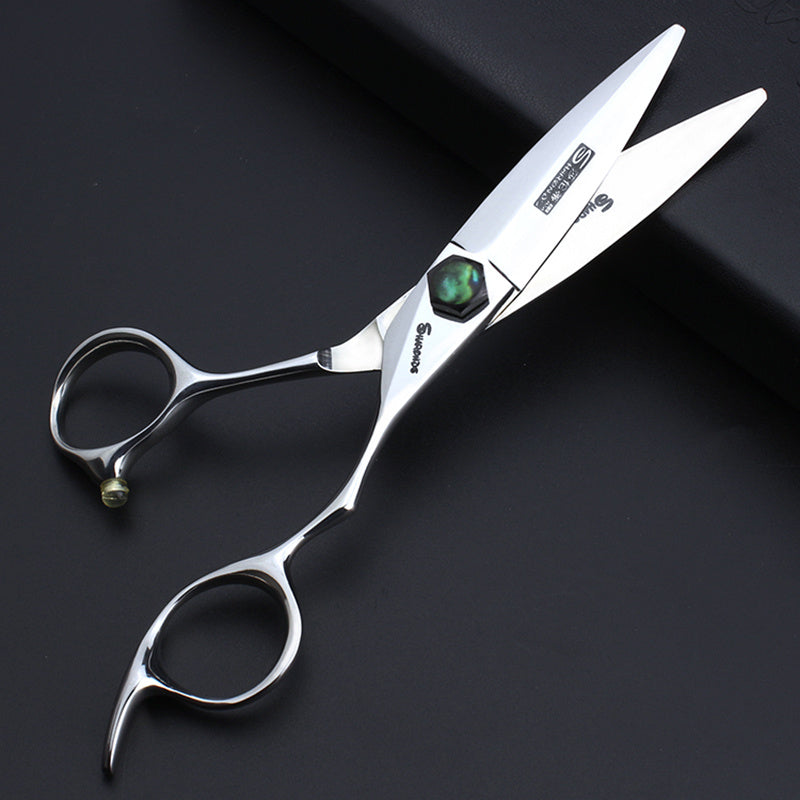 Silver scissors with a brand logo on a black background