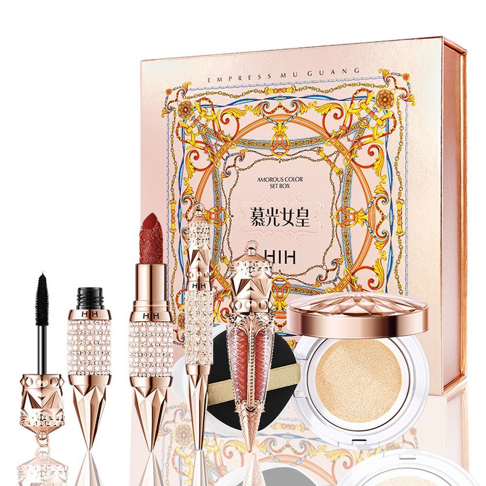 Makeup set with decorative box featuring intricate designs and brand name.