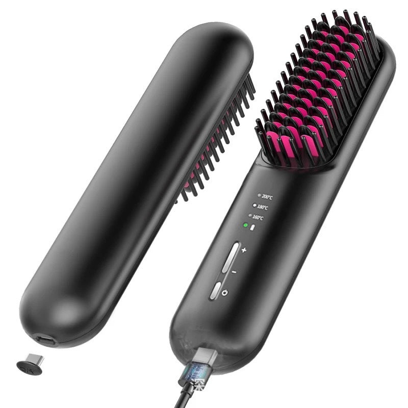 Black hair straightening brush with pink bristle head on a white background