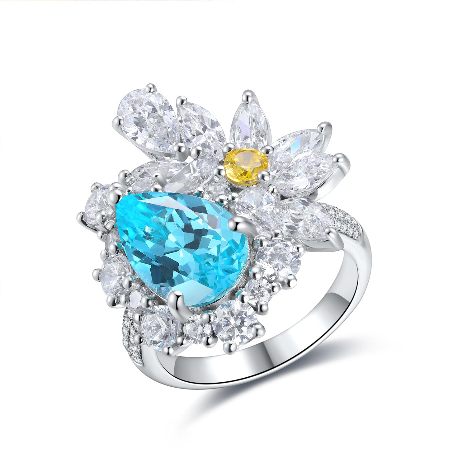 Elegant ring with blue teardrop gem and yellow gemstone on a white background