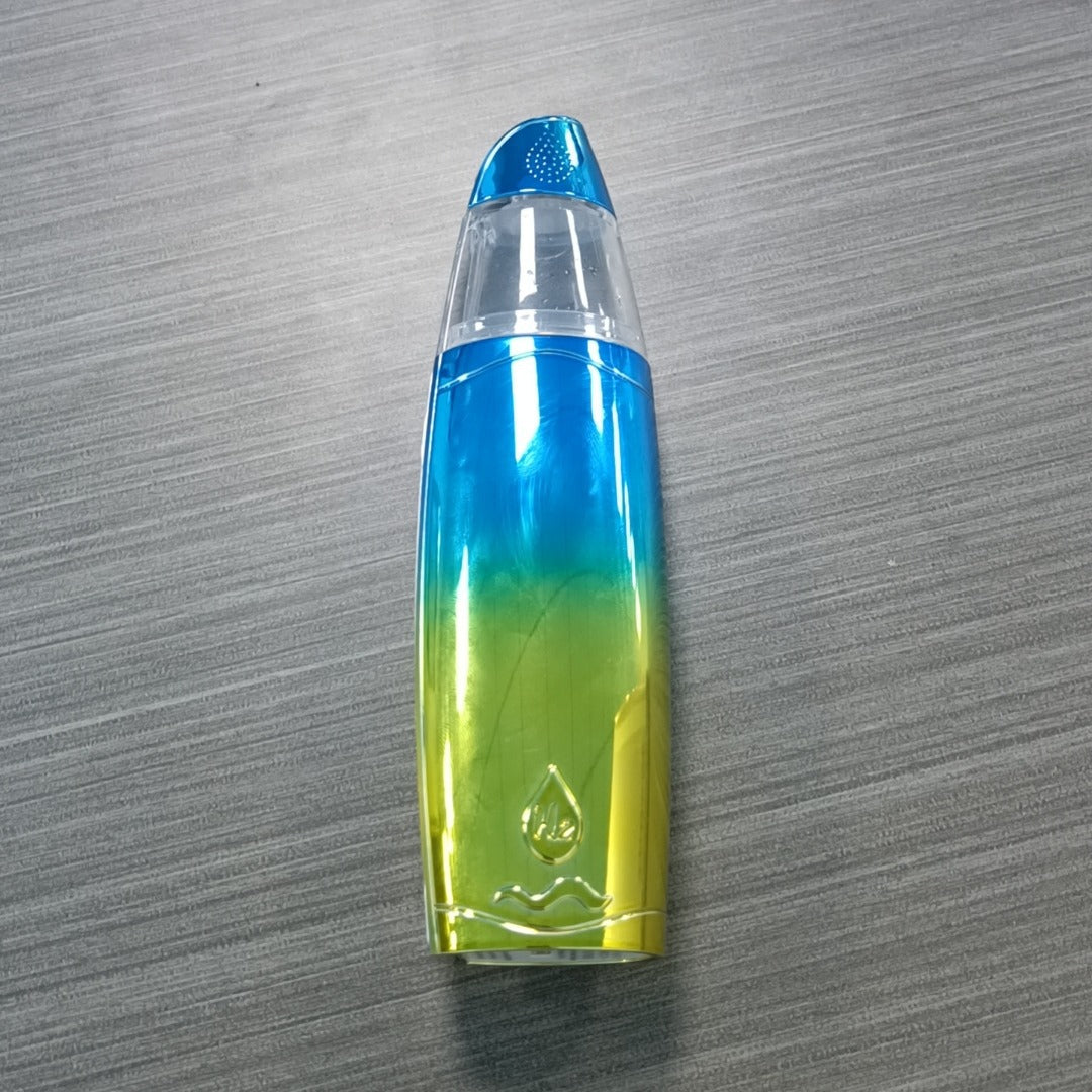 Multicolored cosmetic bottle with gradient design on a gray surface