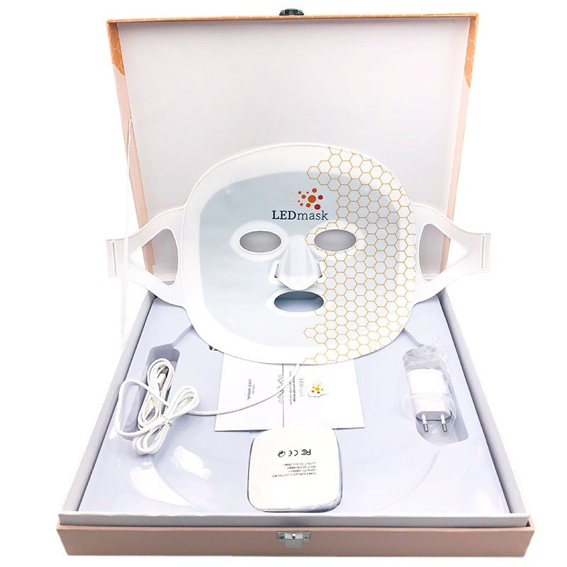 LED facial mask in a box with accessories on a white background