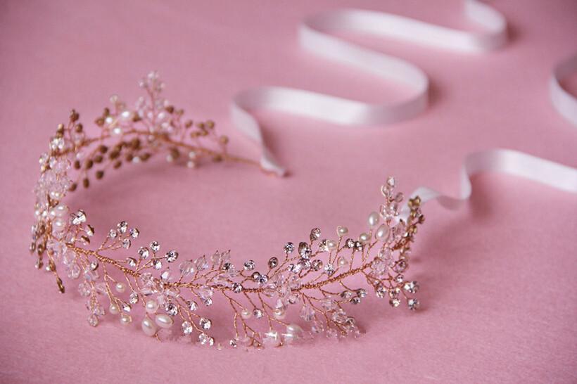 Pink tiara with crystals on a pink background