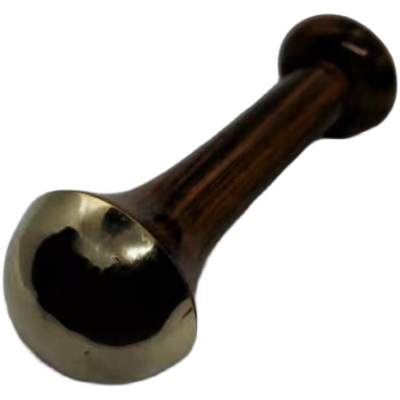 Metallic object with a gold and bronze finish on a white background