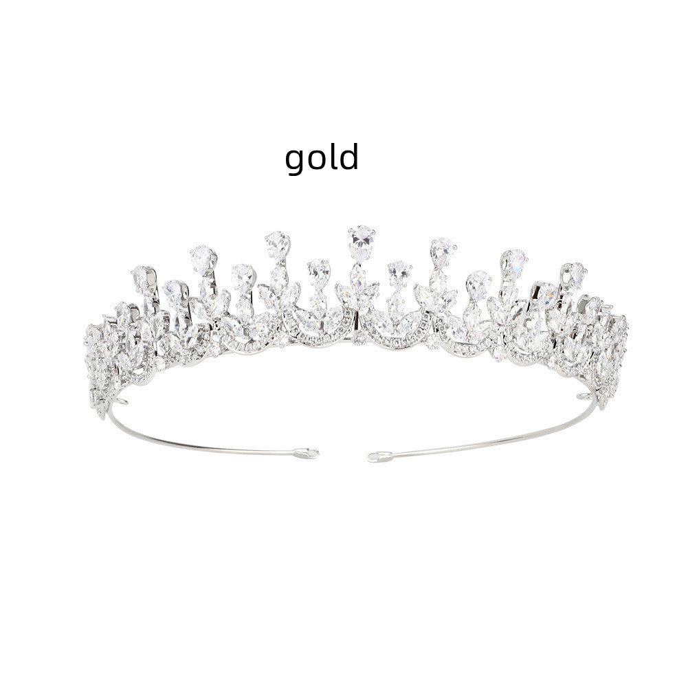 Gold tiara on a white background with 'gold' text above it.
