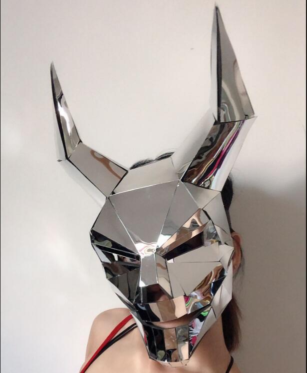 Metallic deer head wall decoration on a plain background