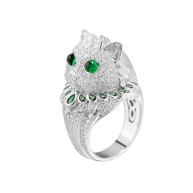Silver ring with green gemstones on a white background