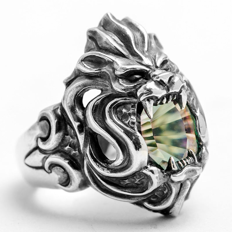 Silver dragon ring with a colorful gemstone on a white background